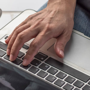person typing on laptop computer