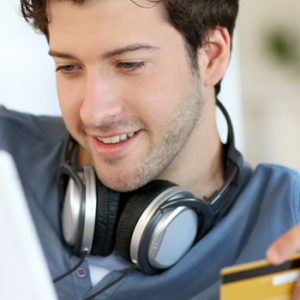 young man with debit card