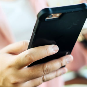 woman holding a cell phone
