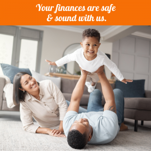 Your finances are safe and sound with us. Family in house playing - dad holding son in air like airplane